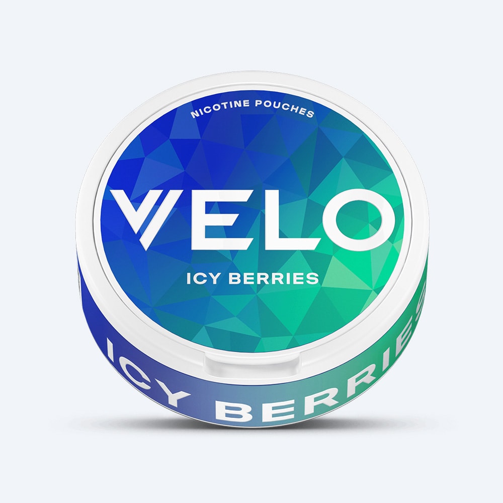 Round container of VELO Icy Berries nicotine pouches featuring a blue and green geometric patterned lid.