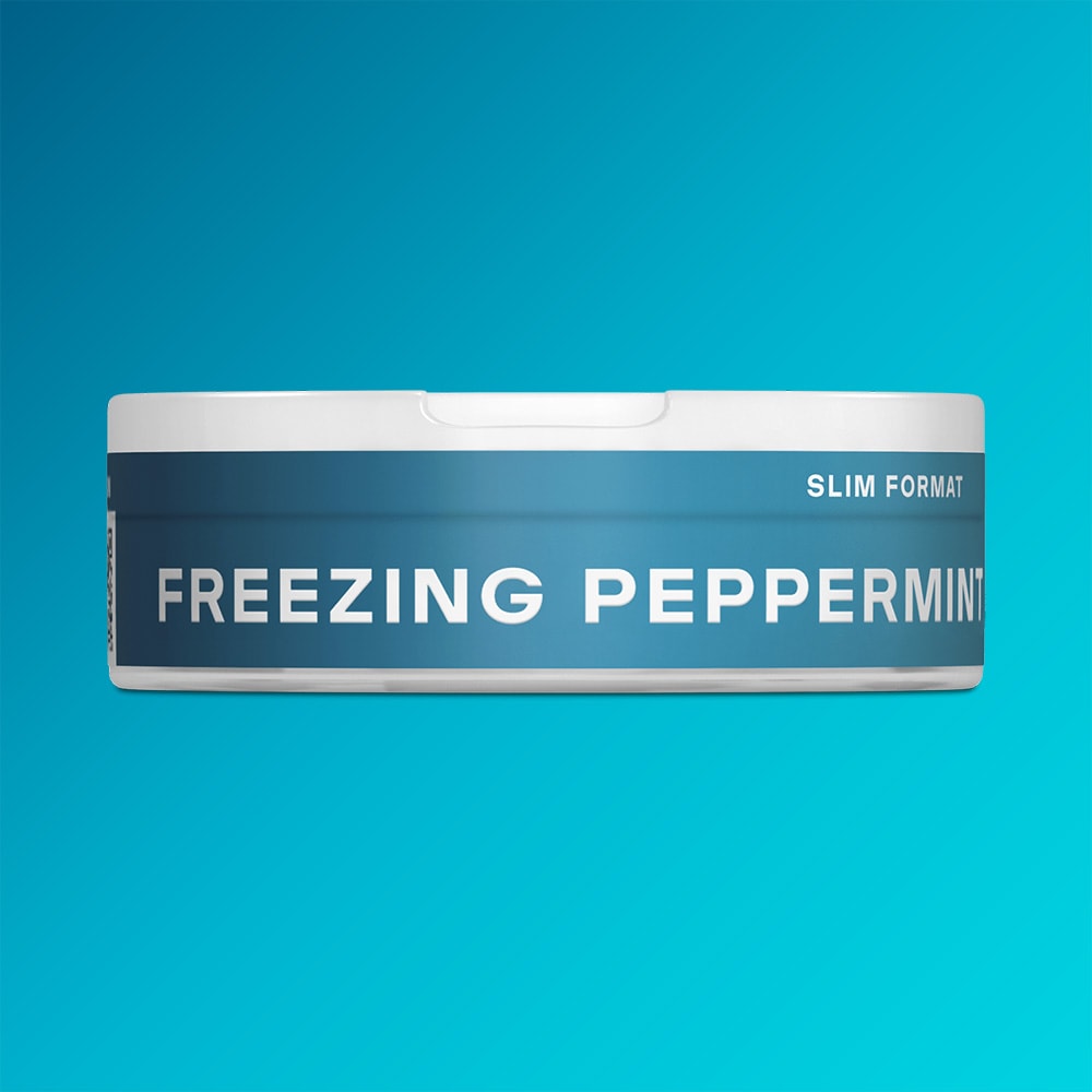 Round container of VELO Freezing Peppermint nicotine pouches with a fresh menthol blue label and slim format.